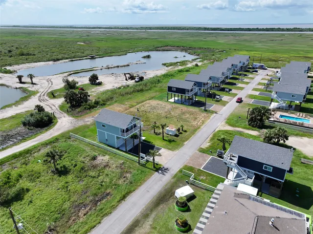 an aerial view of a house with a garden