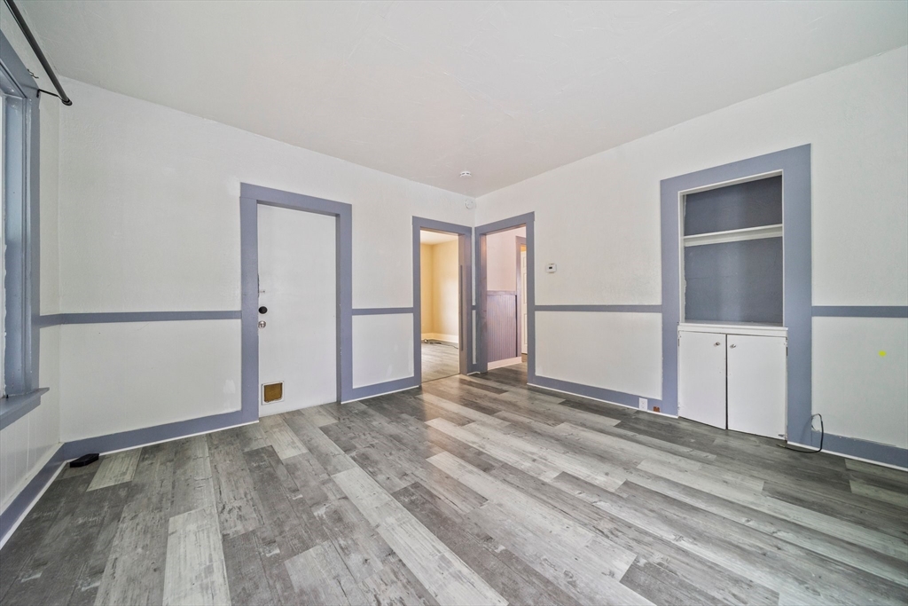 20 Rodney Street Worcester, MA 01605 - Photo 13 of 35 a view of empty room with wooden floor