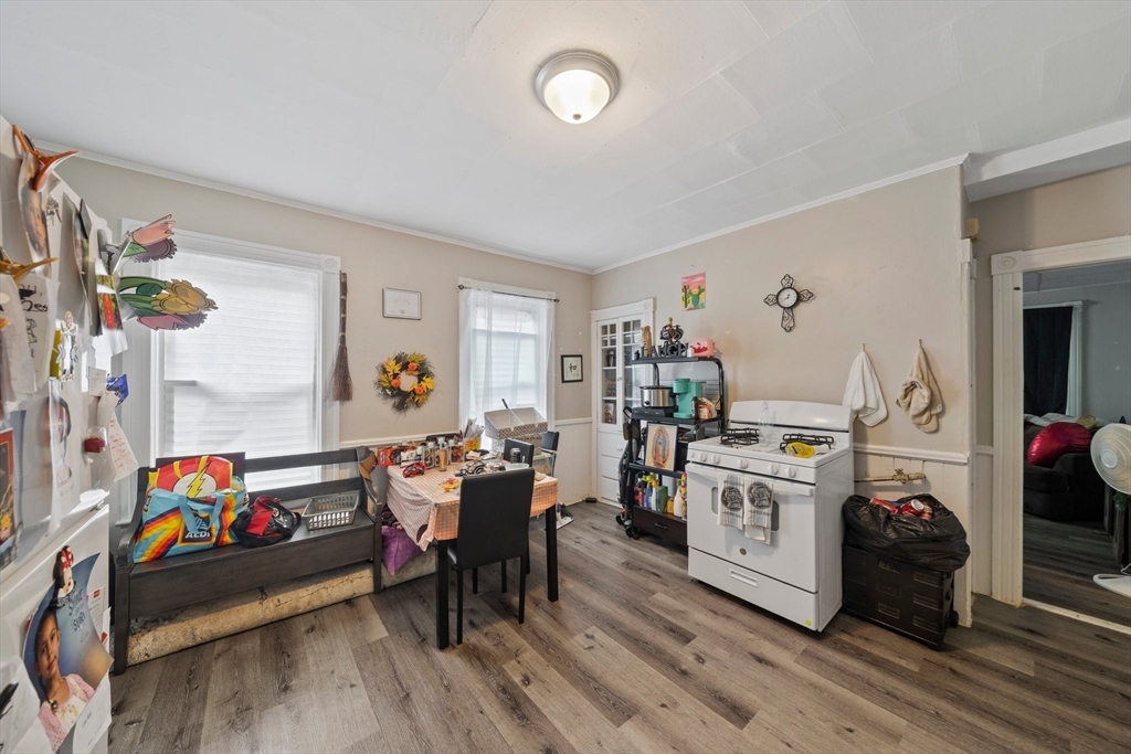 20 Rodney Street Worcester, MA 01605 - Photo 22 of 35 a living room with furniture and a baby crib