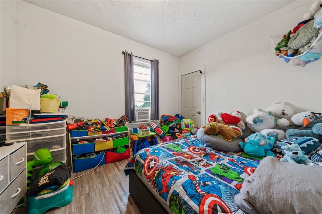 20 Rodney Street Worcester, MA 01605 - Photo 29 of 35 a bedroom with a bed and a toys