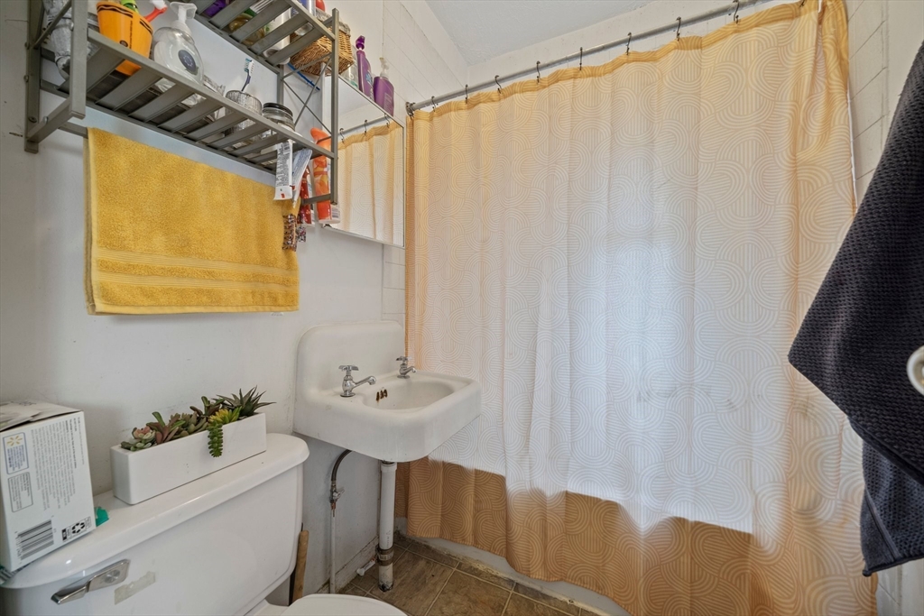 20 Rodney Street Worcester, MA 01605 - Photo 30 of 35 a bathroom with a sink and a mirror