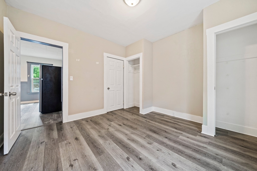 20 Rodney Street Worcester, MA 01605 - Photo 8 of 35 a view of an empty room with wooden floor