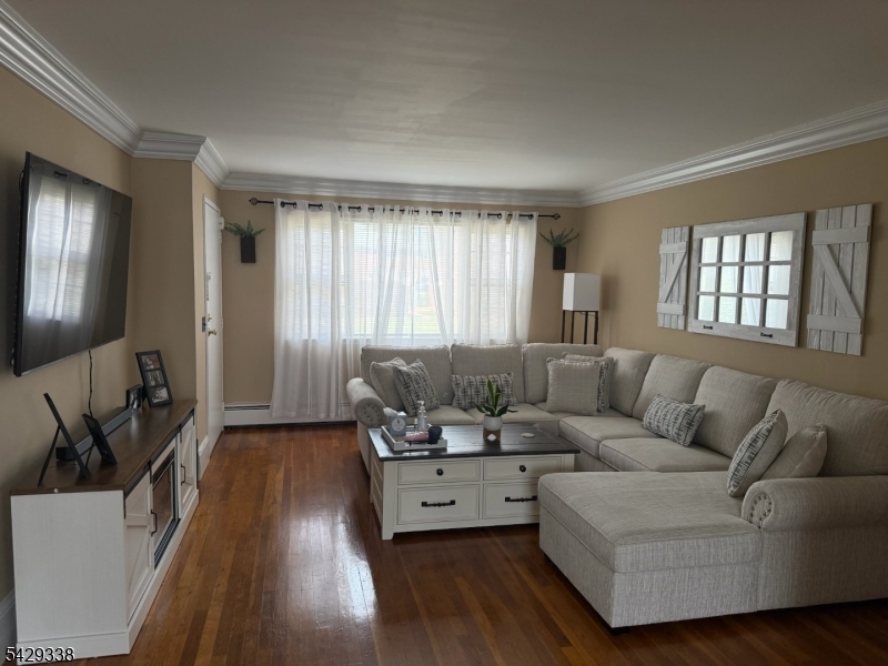 1173 Valley Road Wayne, NJ 07470 - Photo 6 of 11 a living room with furniture and a large window
