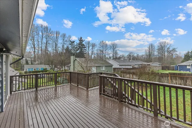 a view of a balcony with wooden floor