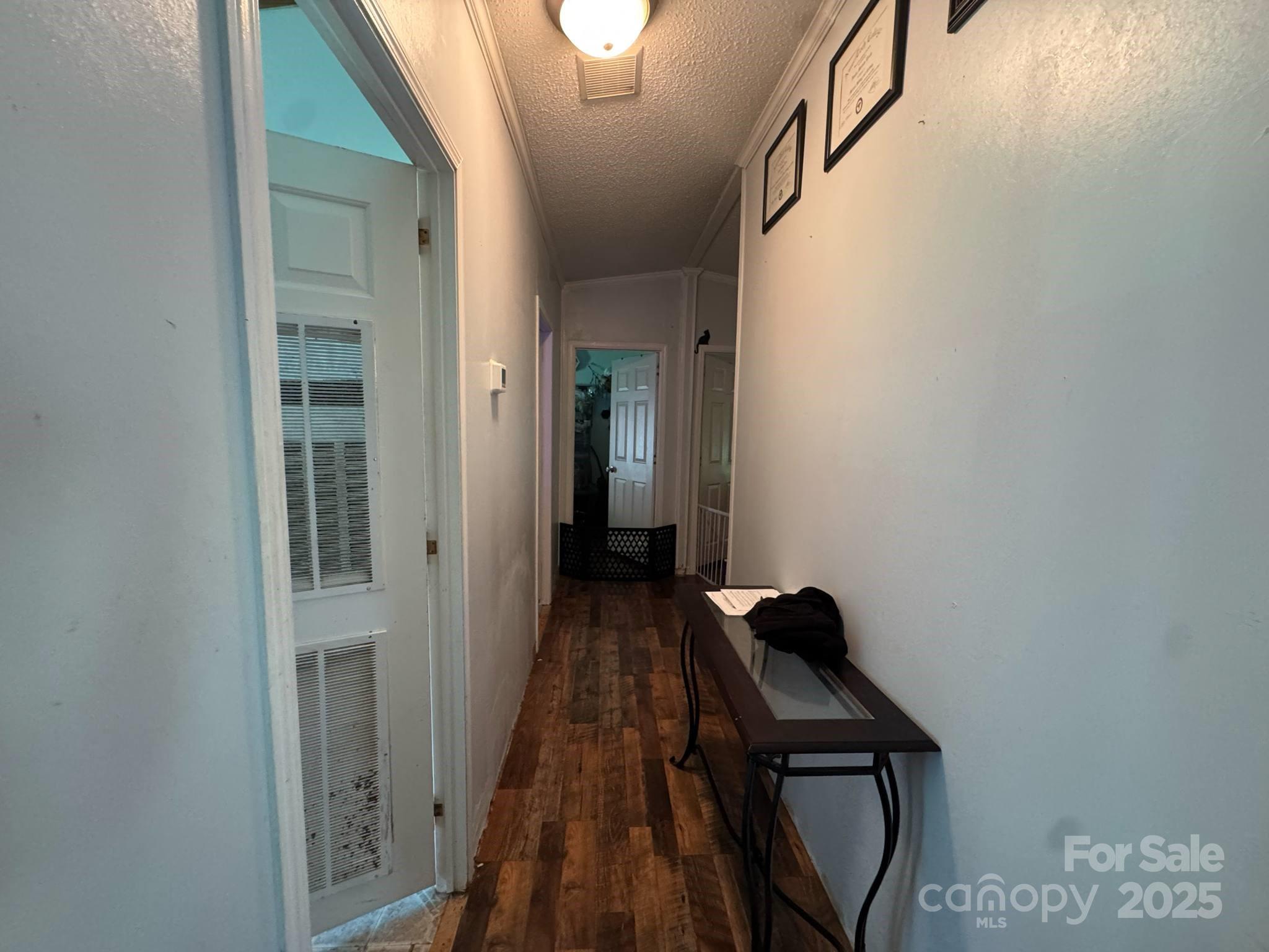 2194 Sterling Ridge Drive Newton, NC 28658 - Photo 13 of 26 a view of a hallway with wooden floor and staircase