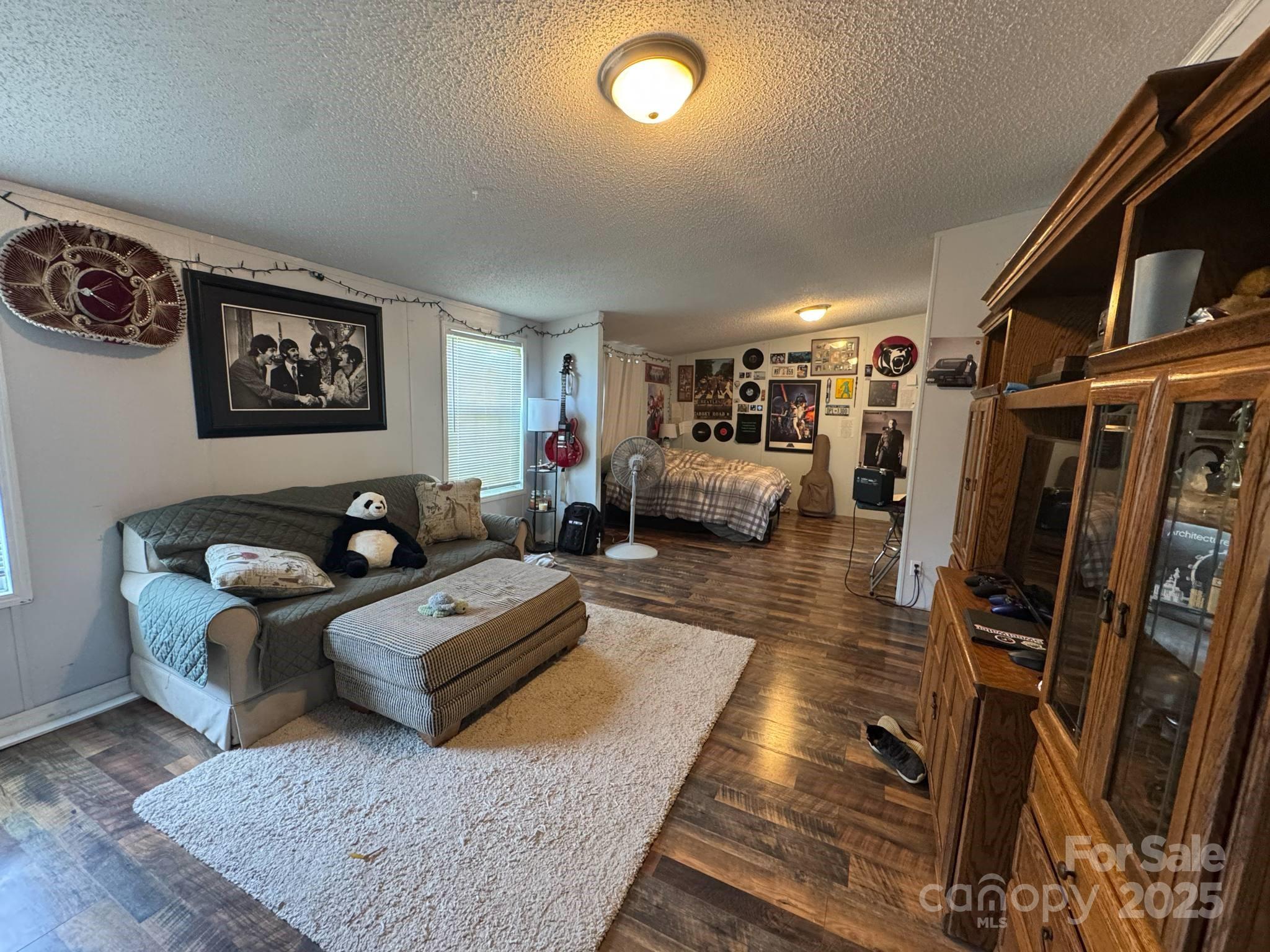 2194 Sterling Ridge Drive Newton, NC 28658 - Photo 17 of 26 a living room with furniture and a flat screen tv