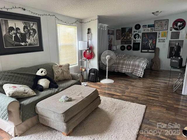 a bed room with a bed a desk and chair