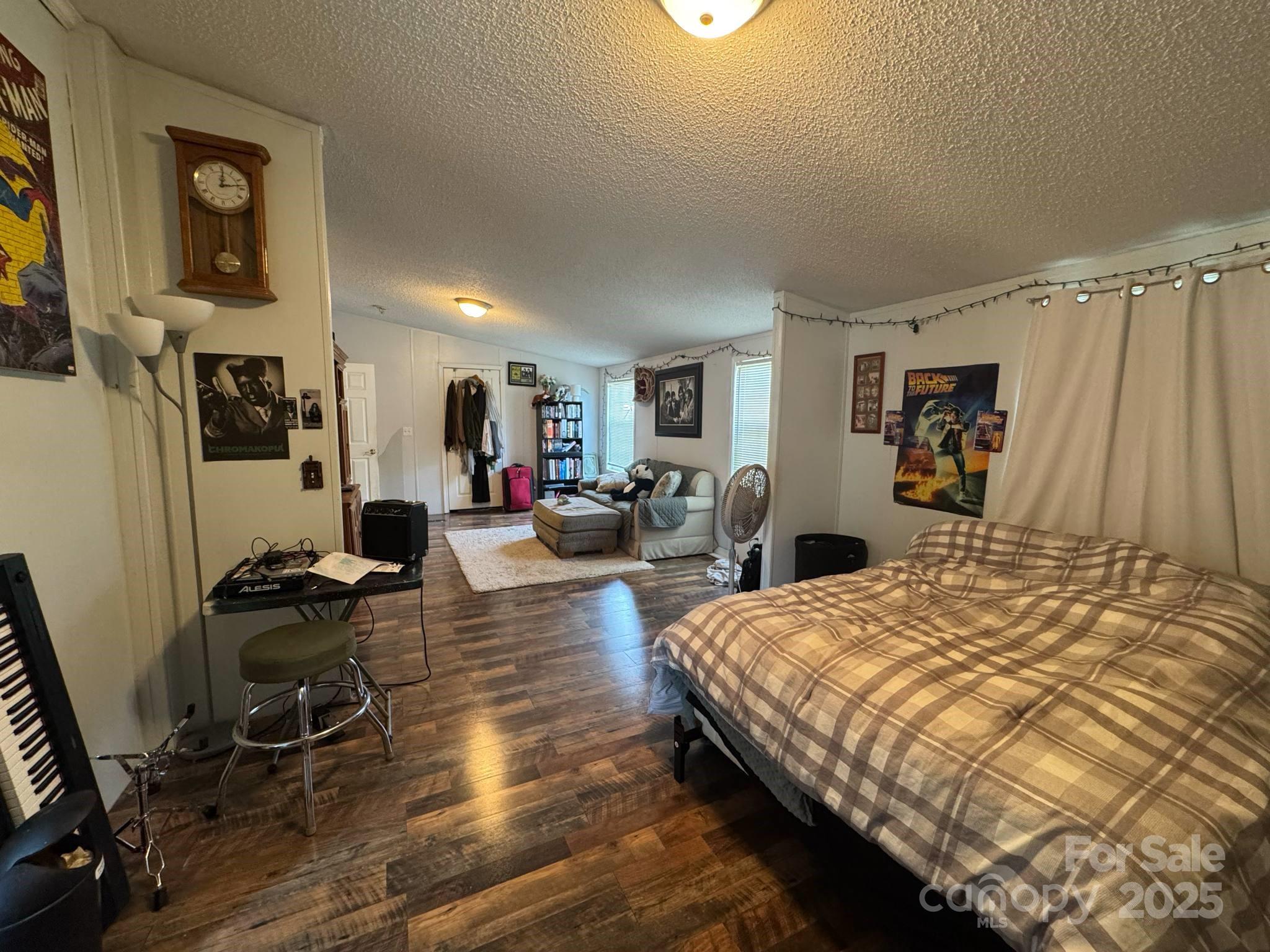2194 Sterling Ridge Drive Newton, NC 28658 - Photo 19 of 26 a bed room with a bed a desk and chair