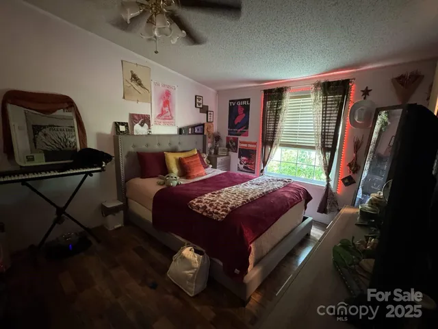 a bed room with a bed and a window