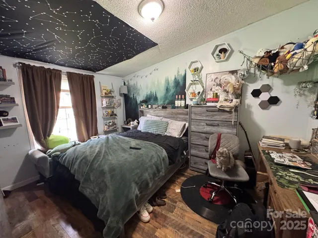 a bathroom with a tub a rug and a window