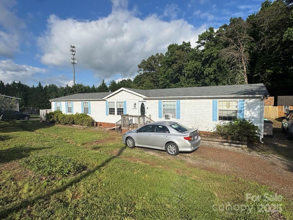 2194 Sterling Ridge Drive Newton, NC 28658 - Photo 4 of 26 a front view of a house with garden