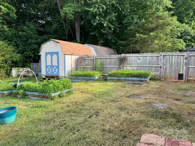 a view of a swimming pool with a yard