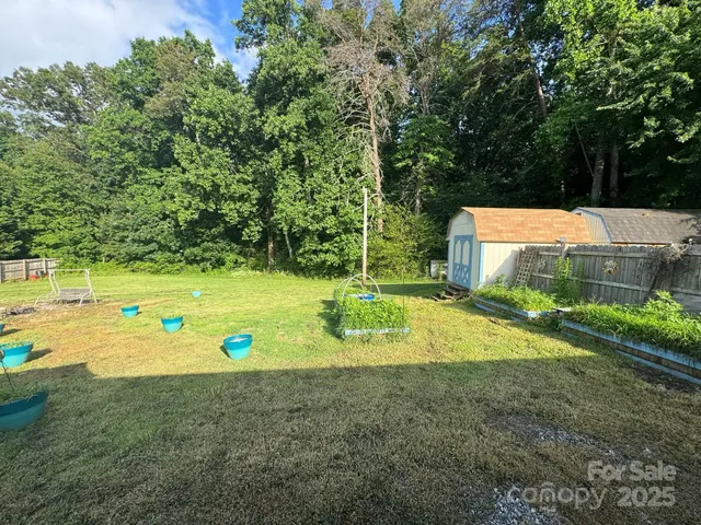 a view of a swimming pool with a yard