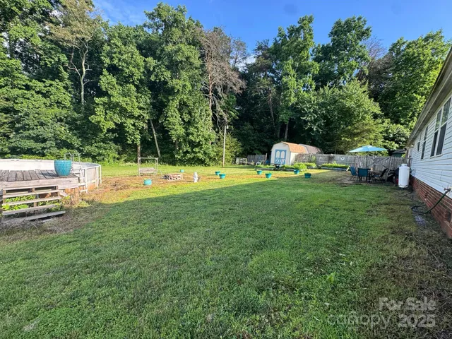 a view of a table and chairs under an umbrella