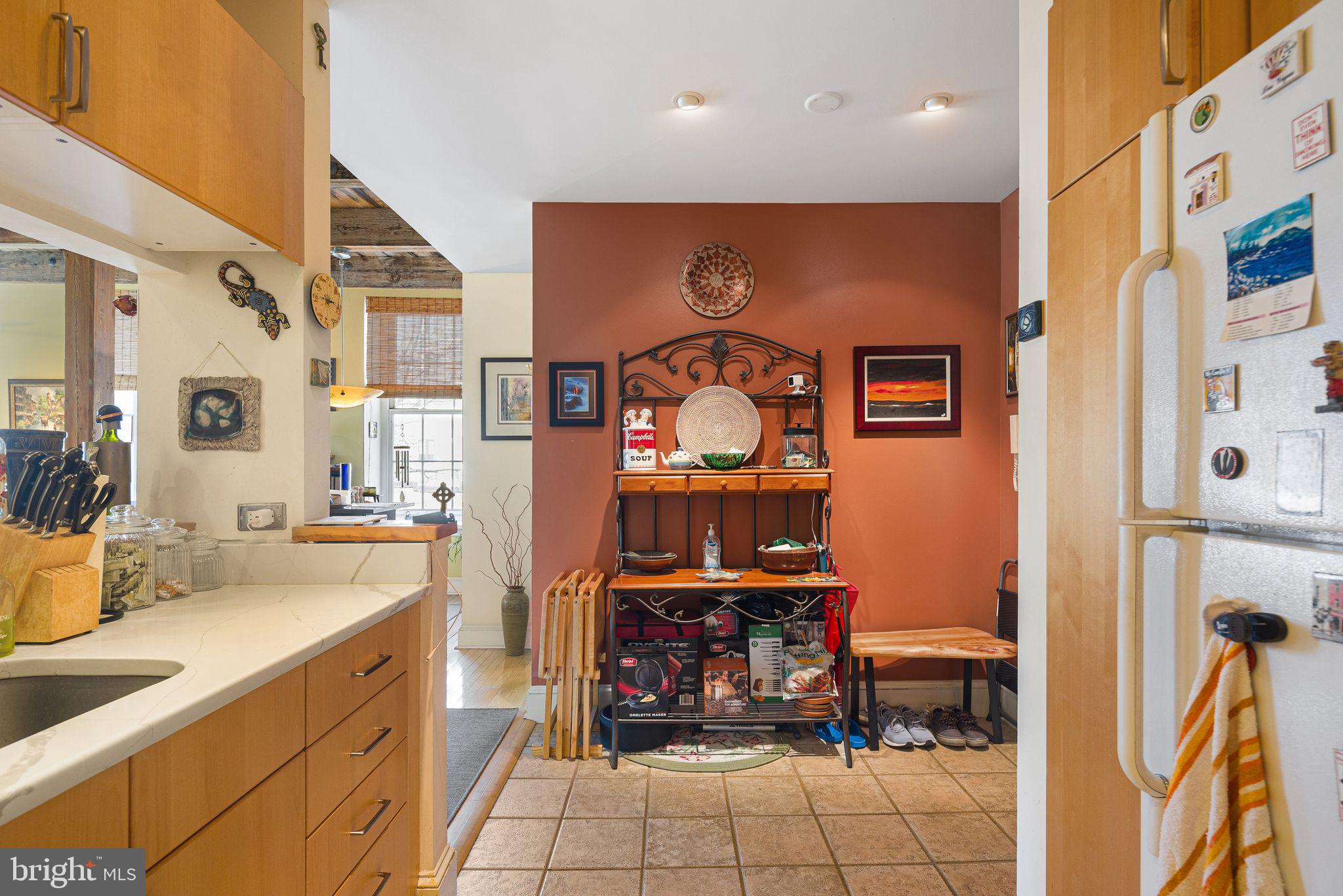 214 New Street, Unit C Philadelphia, PA 19106 - Photo 12 of 29 a kitchen with stainless steel appliances granite countertop a refrigerator and a sink