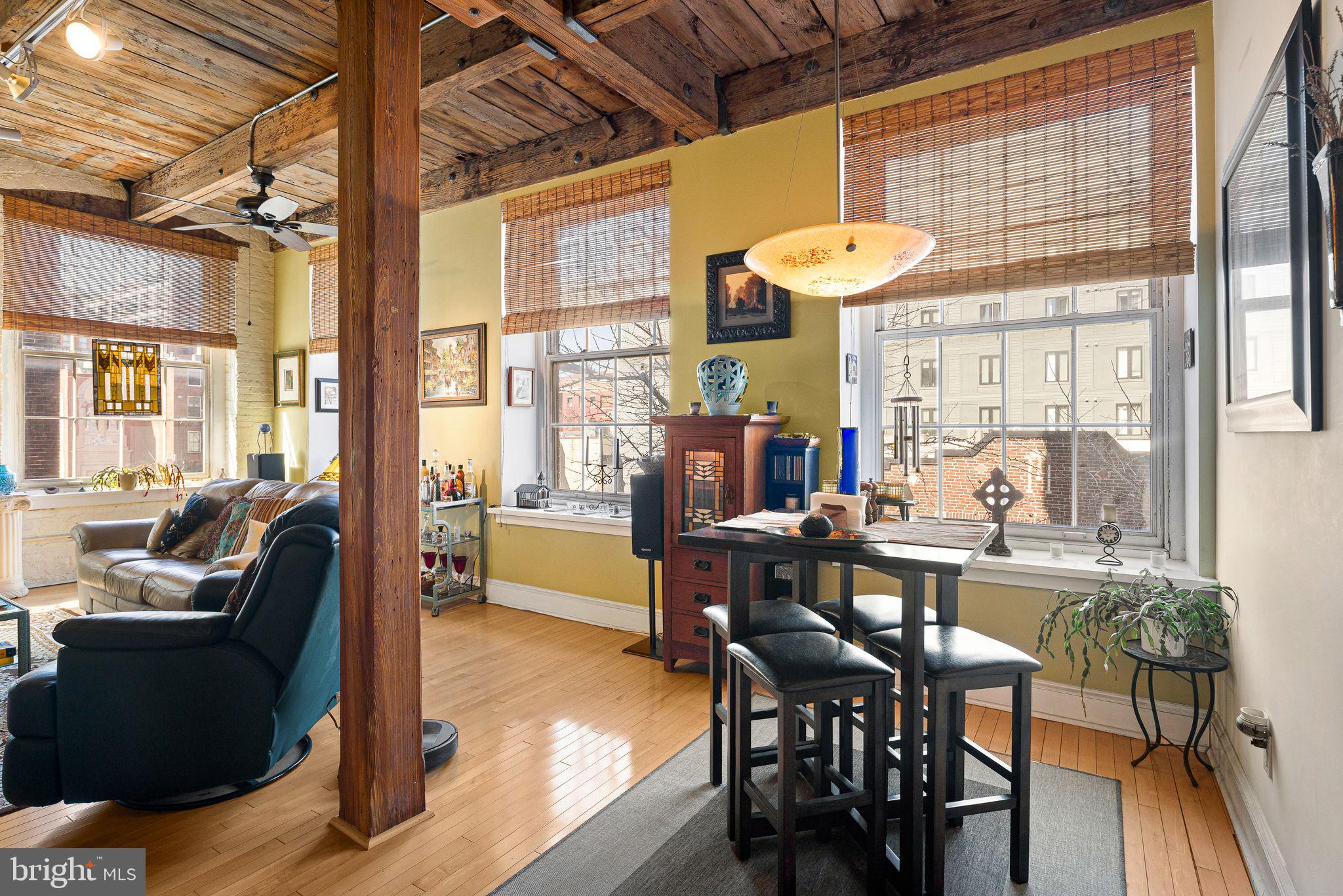 214 New Street, Unit C Philadelphia, PA 19106 - Photo 5 of 29 a view of a dining room with furniture wooden floor and chandelier