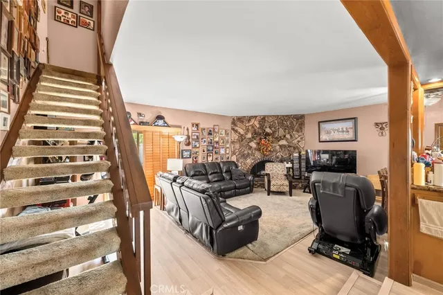 a view of a living room with furniture and a floor to ceiling window