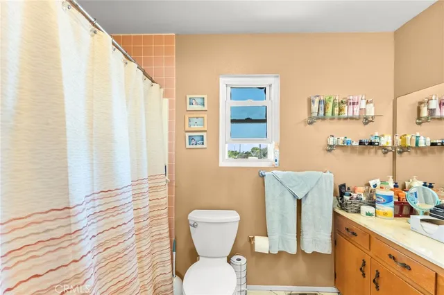 a bathroom with a toilet and a sink
