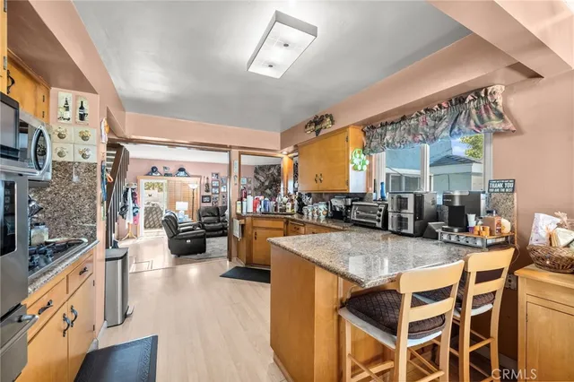 a view of a kitchen and living room