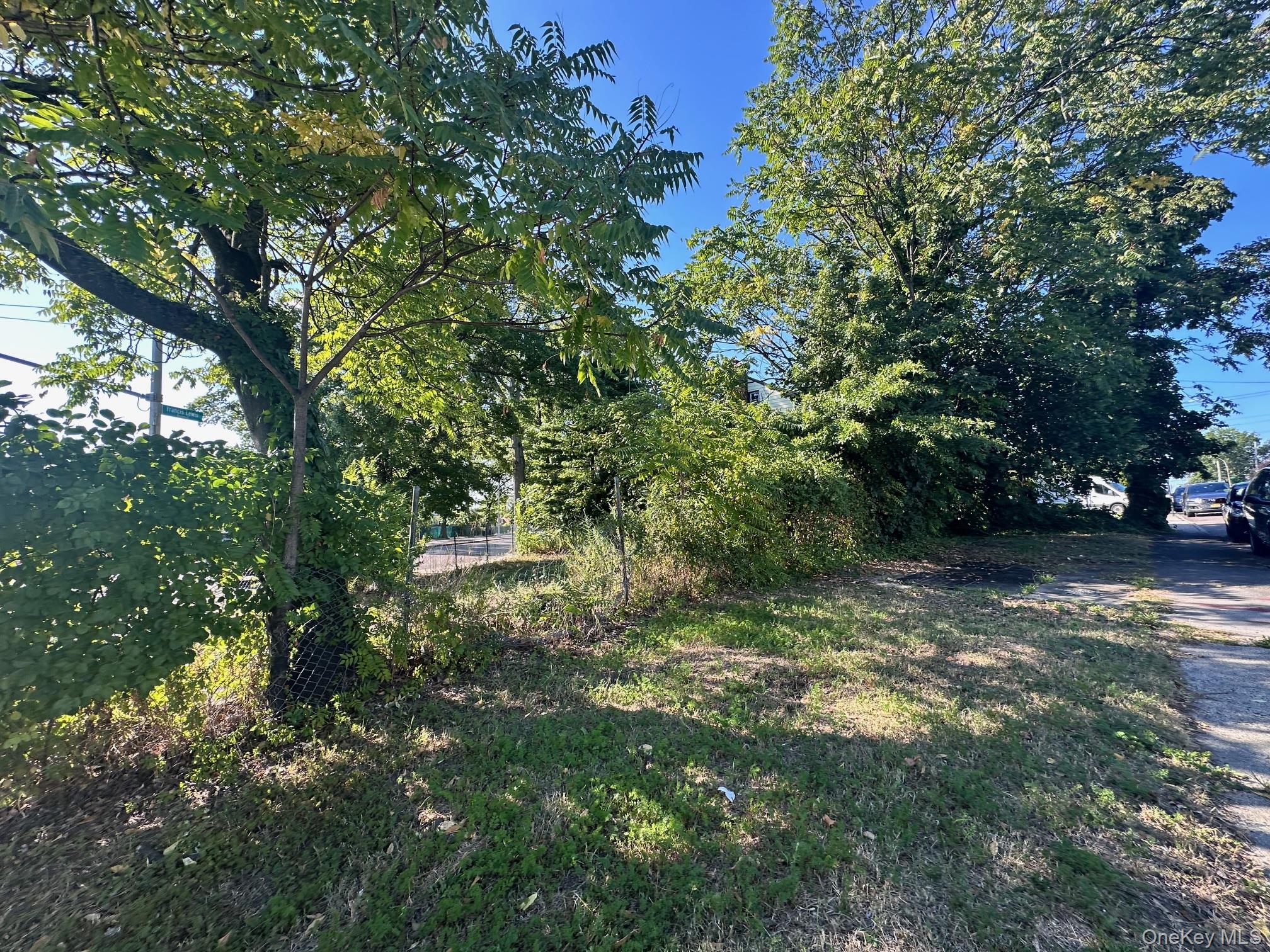 a view of outdoor space with trees all around