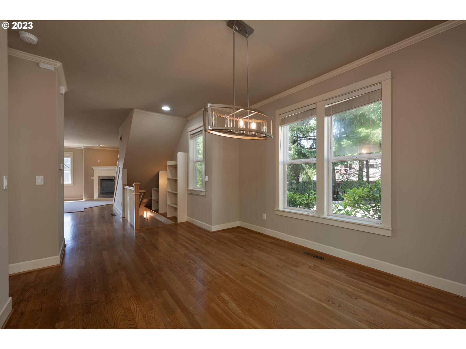 2213 St Moritz Loop West Linn, OR 97068 - Photo 12 of 48 a view of an empty room with window wooden floor and front door