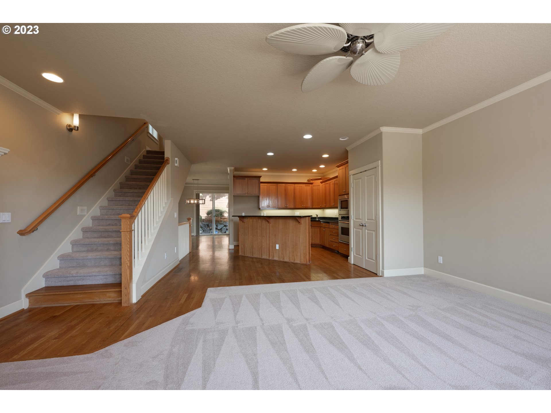 2213 St Moritz Loop West Linn, OR 97068 - Photo 17 of 48 a view of a room with wooden floor and staircase