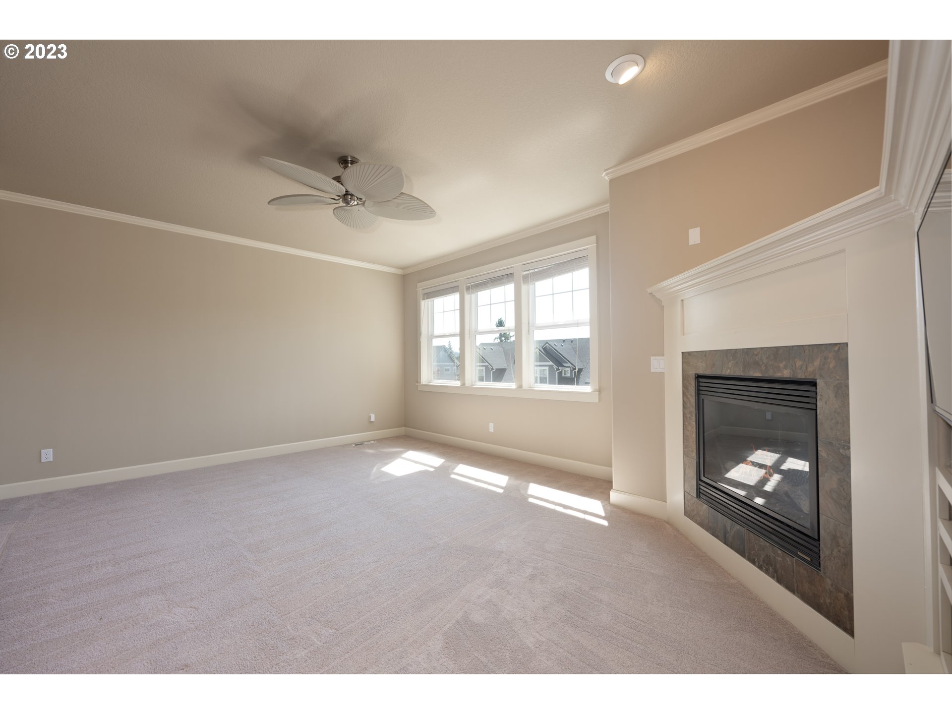 2213 St Moritz Loop West Linn, OR 97068 - Photo 18 of 48 a view of an empty room with a fireplace and a window
