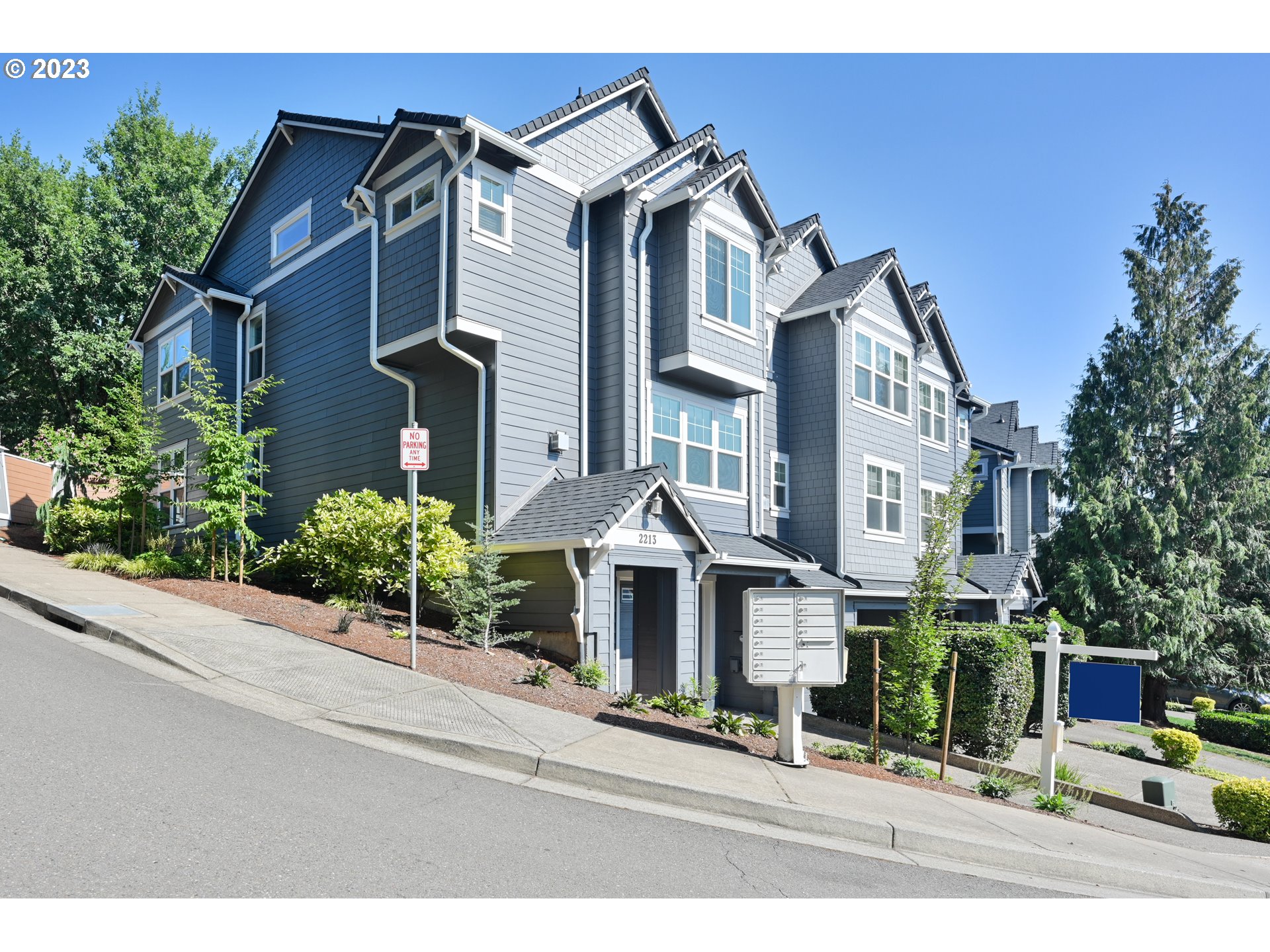 2213 St Moritz Loop West Linn, OR 97068 - Photo 2 of 48 a front view of a house with a yard
