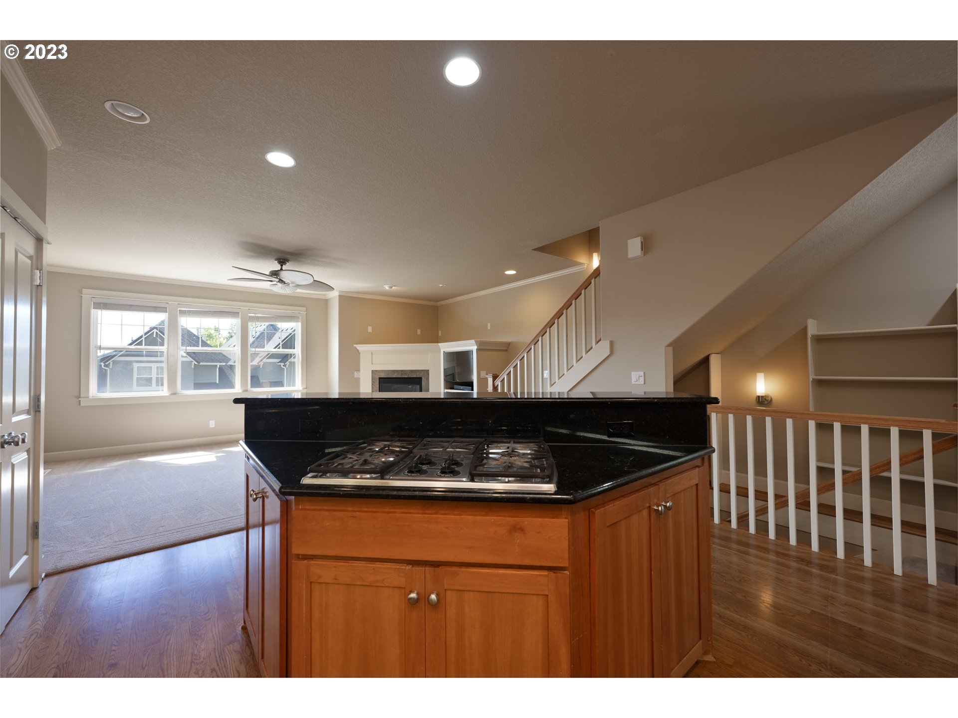 2213 St Moritz Loop West Linn, OR 97068 - Photo 21 of 48 a kitchen with stainless steel appliances granite countertop a sink a stove a counter space and a refrigerator