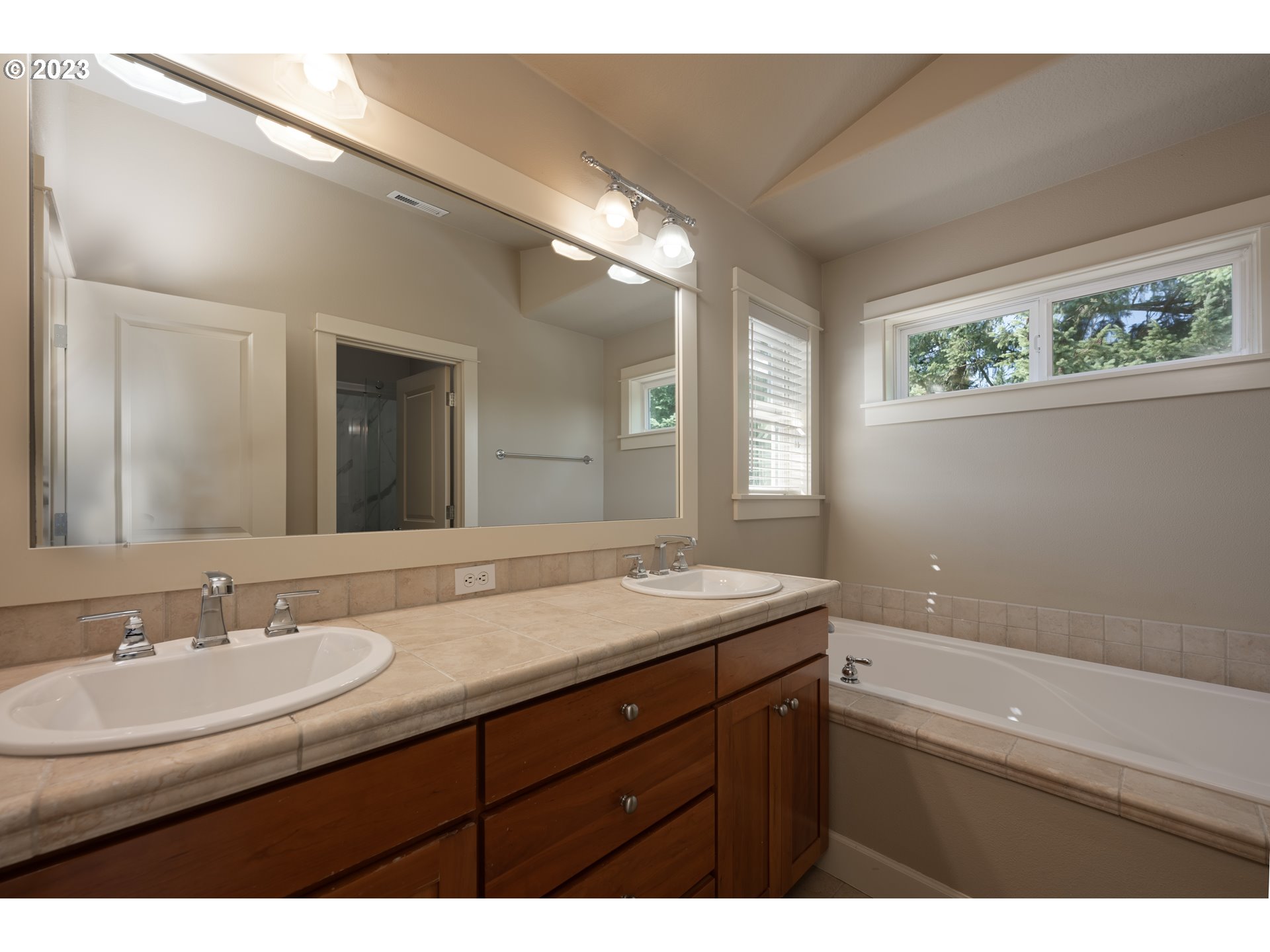 2213 St Moritz Loop West Linn, OR 97068 - Photo 38 of 48 a bathroom with a sink and a mirror
