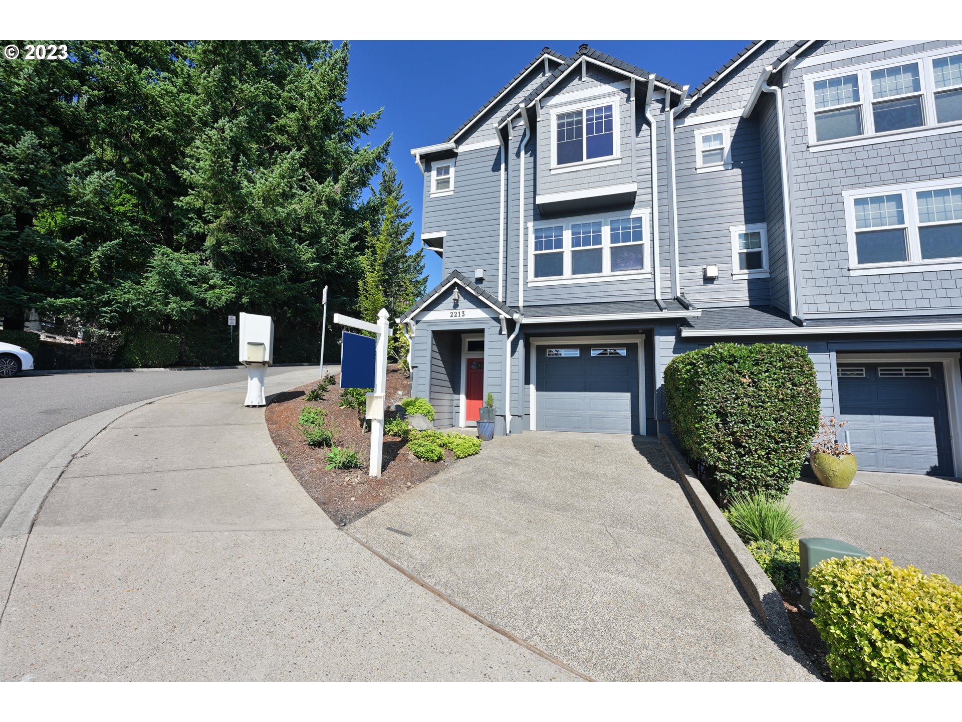 2213 St Moritz Loop West Linn, OR 97068 - Photo 4 of 48 a front view of a house with a yard