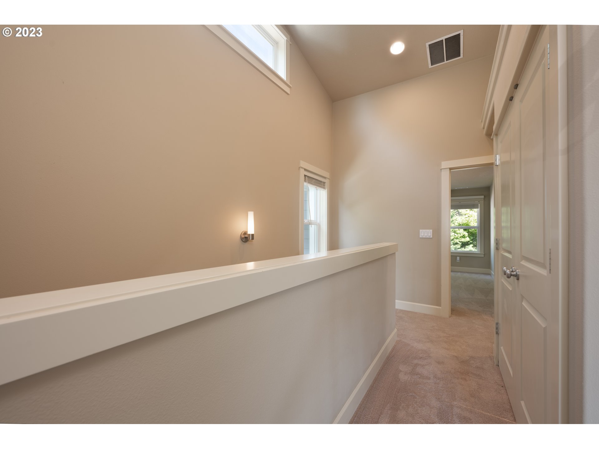 2213 St Moritz Loop West Linn, OR 97068 - Photo 41 of 48 a view of an empty room with wooden floor