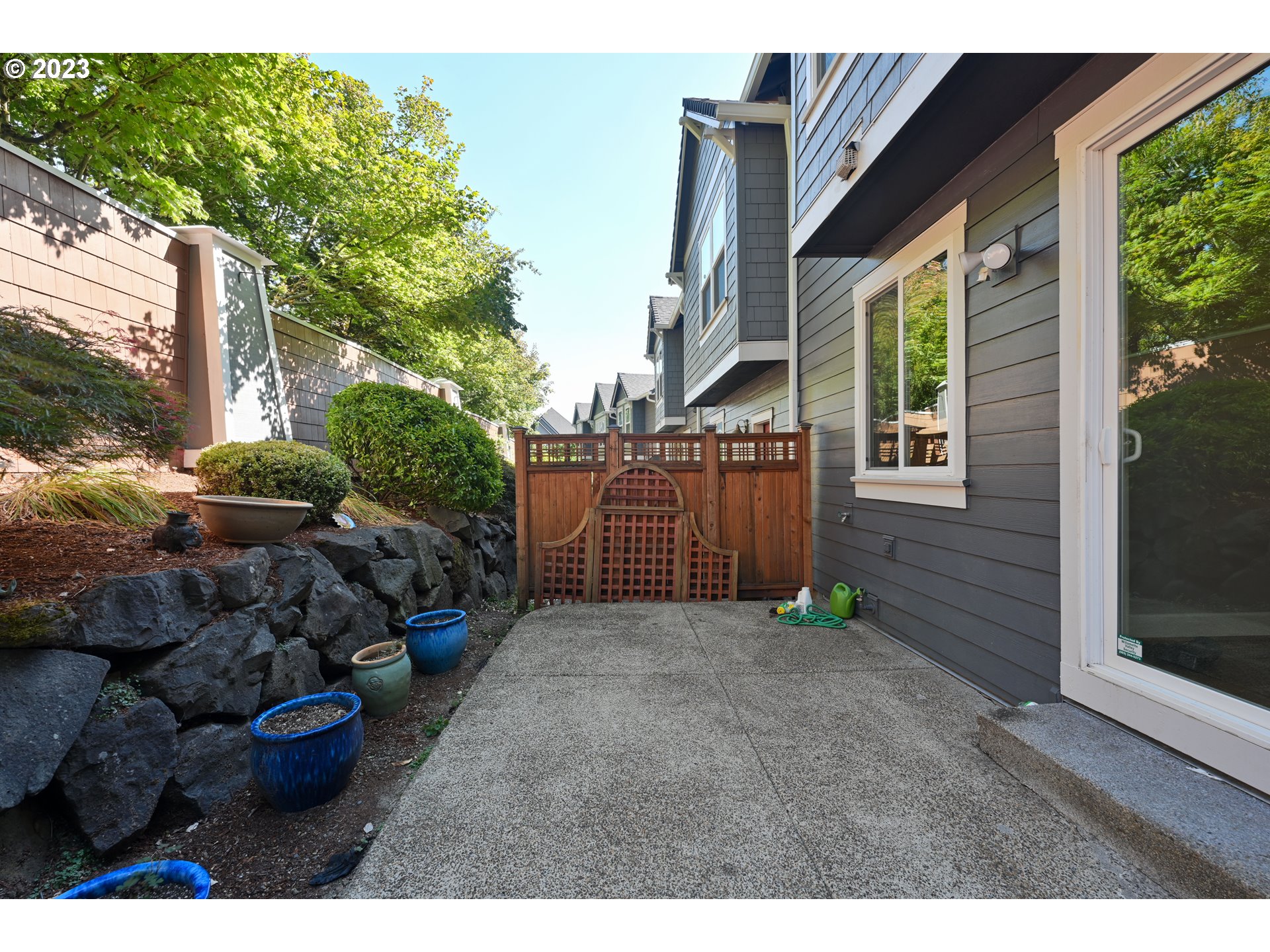 2213 St Moritz Loop West Linn, OR 97068 - Photo 5 of 48 a view of a backyard with plants