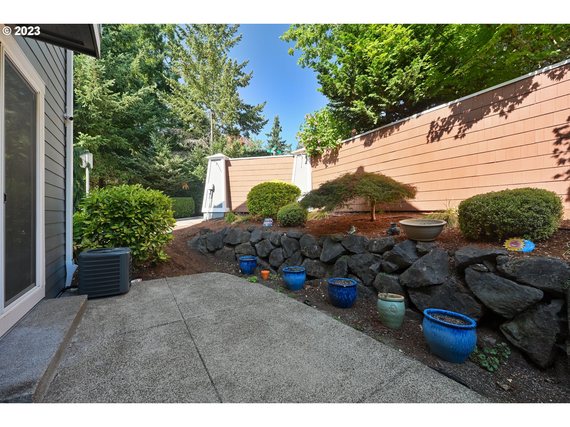 2213 St Moritz Loop West Linn, OR 97068 - Photo 6 of 48 a backyard of a house with lots of green space