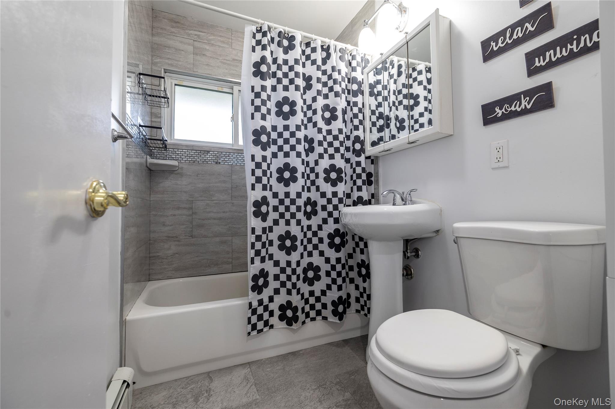 10 Rural Lane Levittown, NY 11756 - Photo 13 of 22 a bathroom with a toilet and a shower