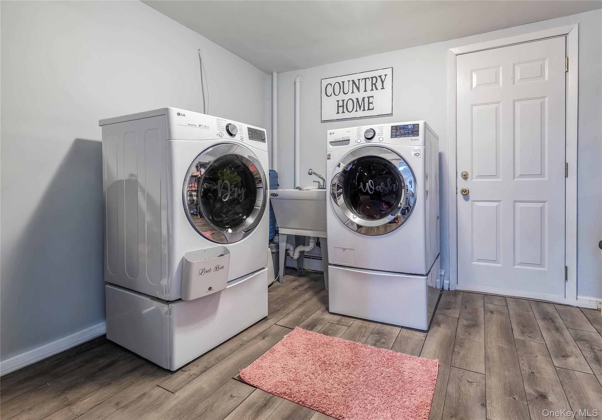 10 Rural Lane Levittown, NY 11756 - Photo 18 of 22 a utility room with dryer and washer