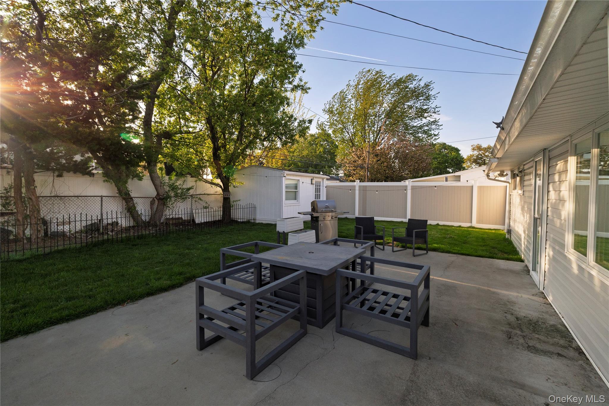 10 Rural Lane Levittown, NY 11756 - Photo 22 of 22 a view of a patio with a yard