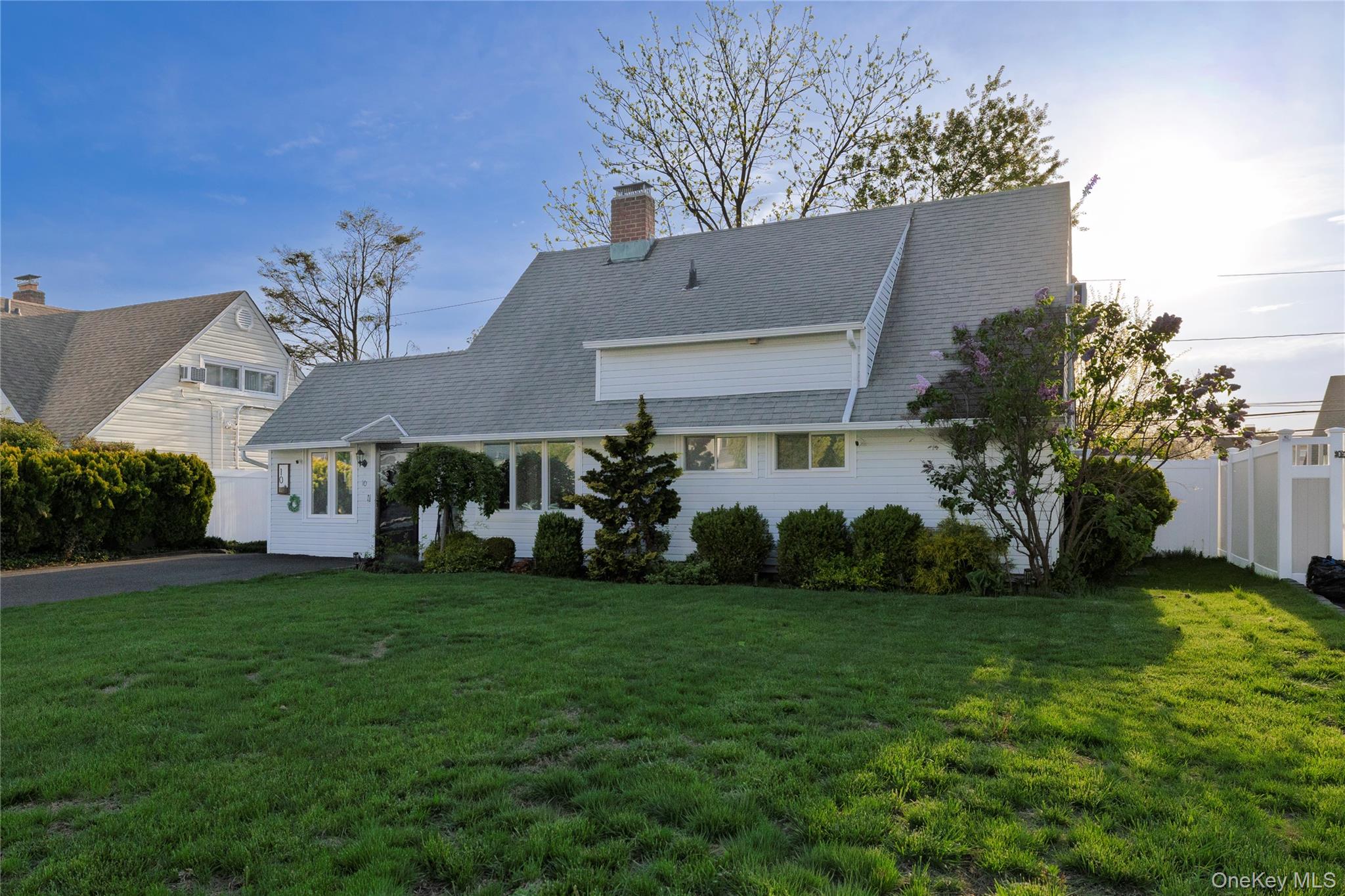10 Rural Lane Levittown, NY 11756 - Photo 3 of 22 a view of a house with a yard