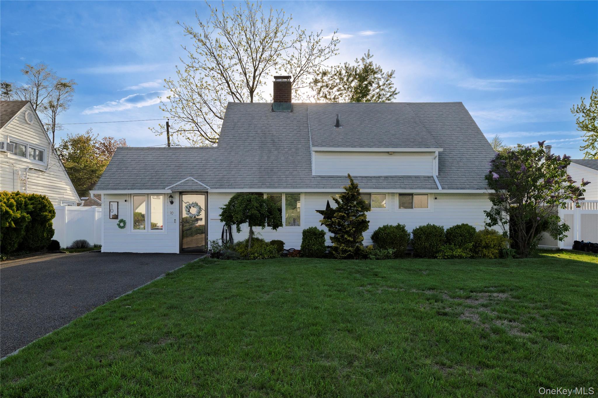 10 Rural Lane Levittown, NY 11756 - Photo 4 of 22 a front view of house with yard and green space