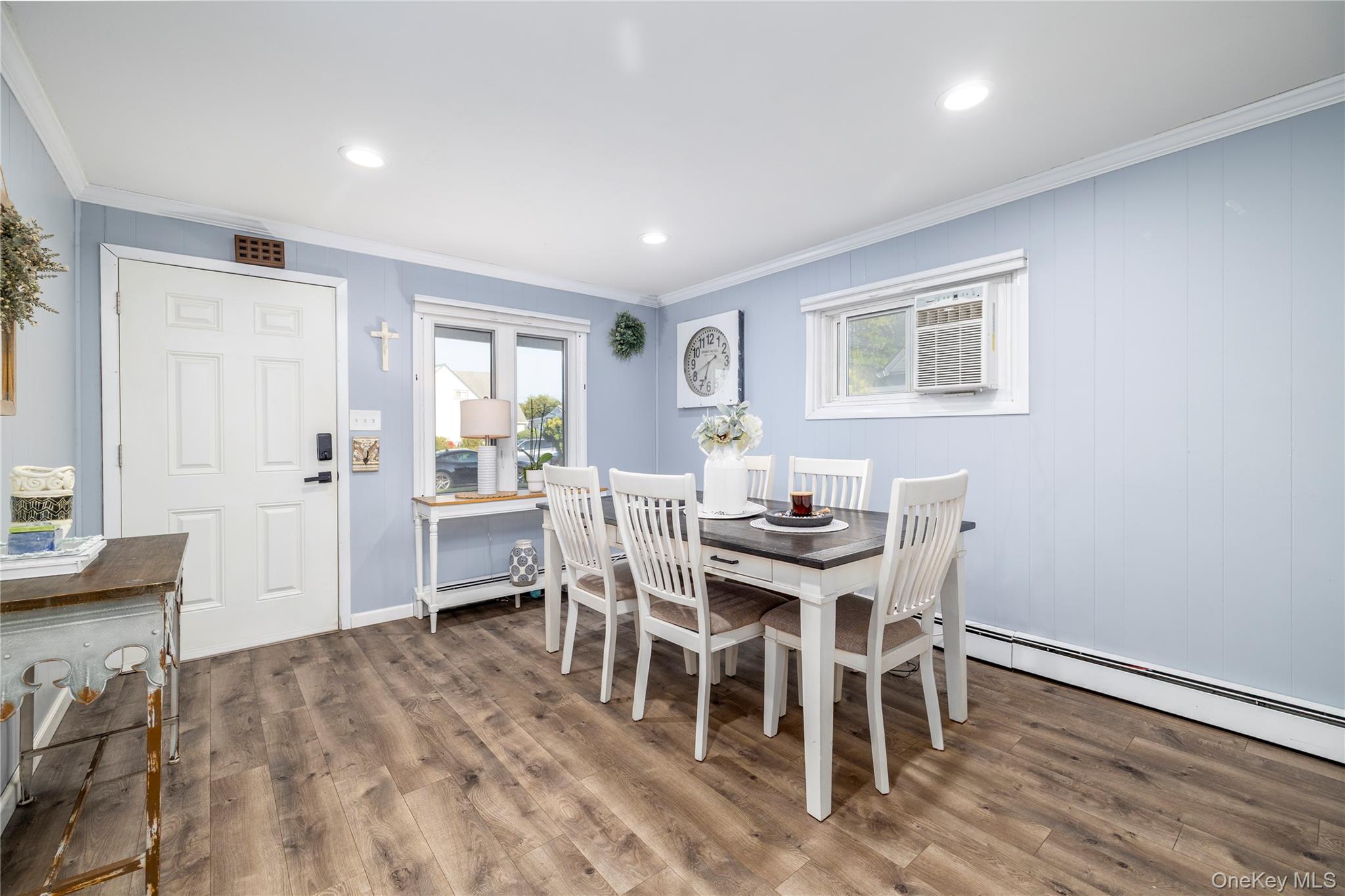 10 Rural Lane Levittown, NY 11756 - Photo 6 of 22 a view of a dining room with furniture and wooden floor
