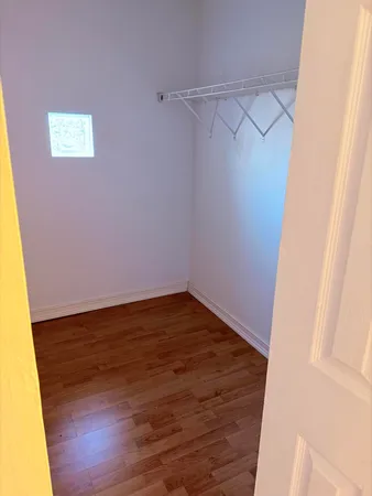 a room with a door and a cabinet