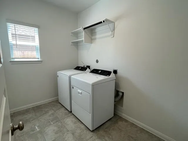 a utility room with dryer and washer