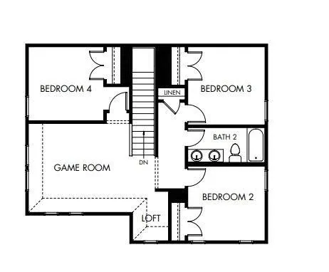 a view of a building and a big yard with a large trees