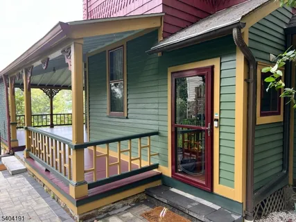 a view of a house with porch and wooden floor