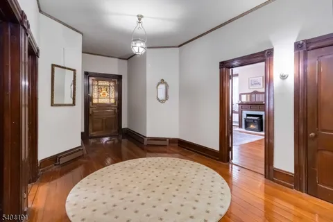a living room with furniture fireplace and window