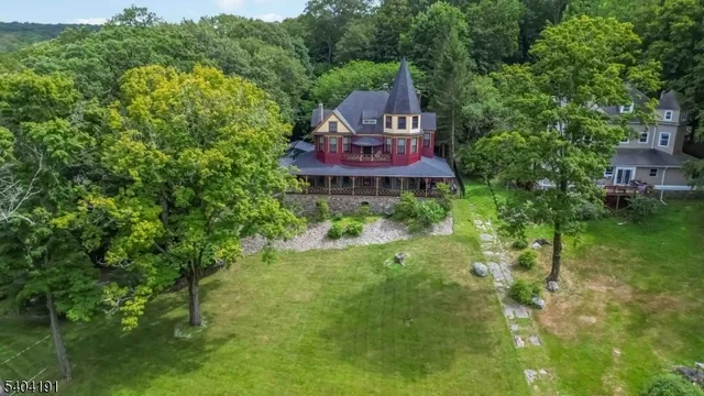an aerial view of a house with outdoor space and street view