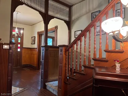 a view of hall way with mirror