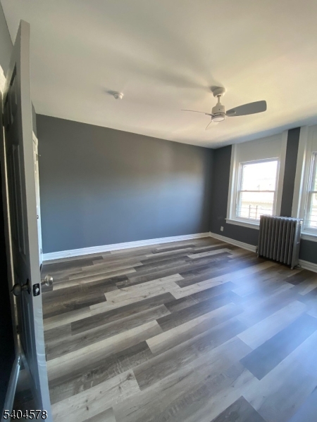 388 South Main Street, Unit 3 Phillipsburg, NJ 08865 - Photo 16 of 16 a view of empty room with wooden floor and fan