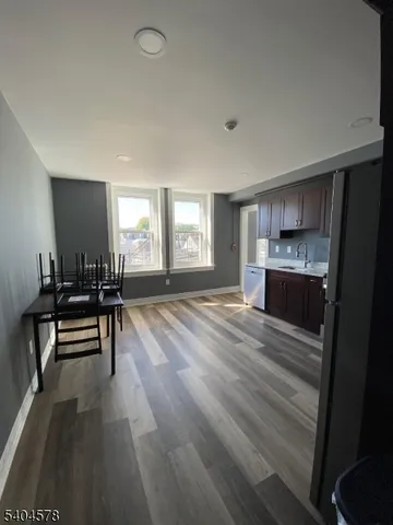 a room with furniture and a wooden floor