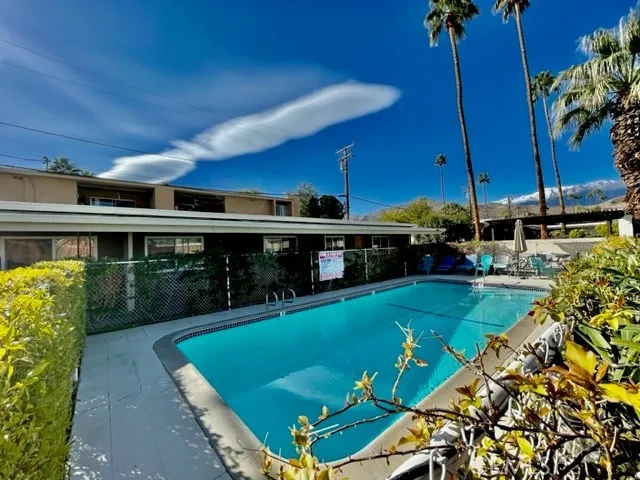 a view of a swimming pool with a patio
